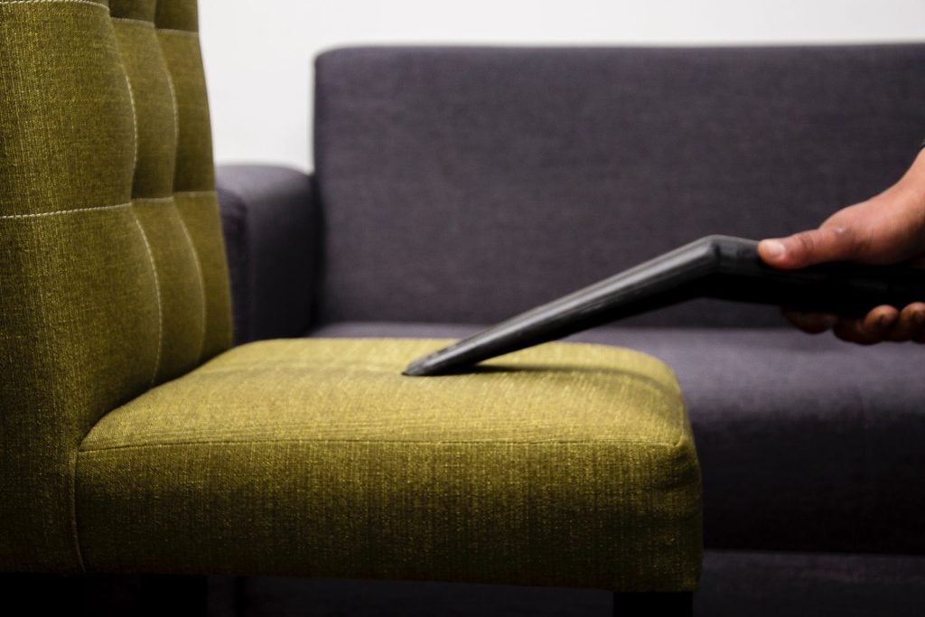 Vacuuming Upholstered Sofa