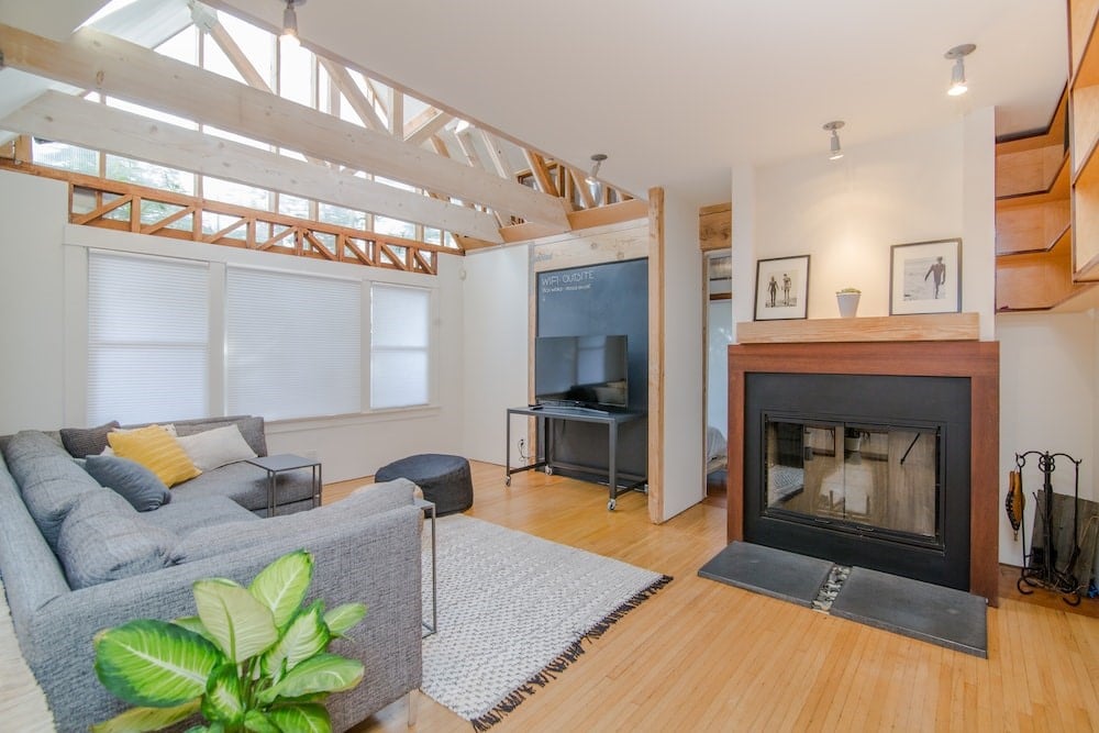 Photo of living room set with green dumb cane plant