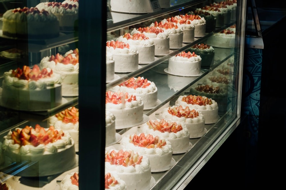 Strawberry cakes displayed on bakeshop