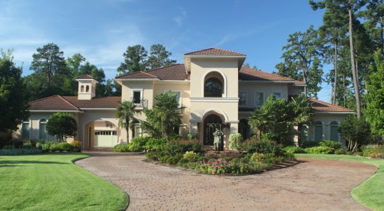 Luxury home exterior under early morning light.